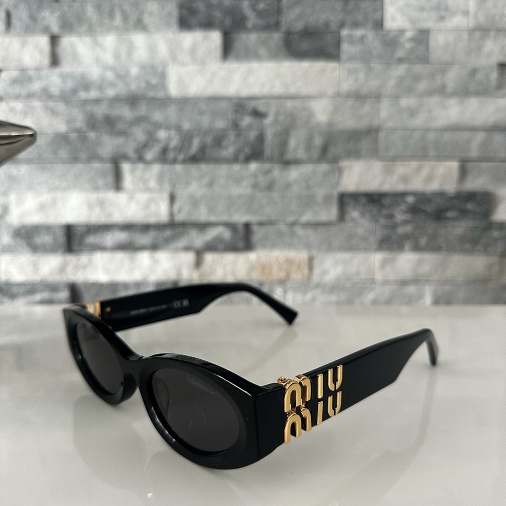 Miu Miu Black Sunglasses with Gold Accents